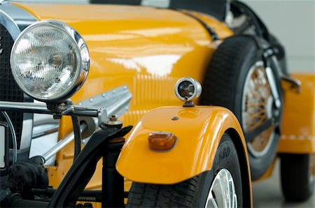 restoring cars - Yellow retro vehicle. Close Up details, car headlamp. Background car details Stock Photo - Budget Royalty-Free & Subscription, Code: 400-05353201