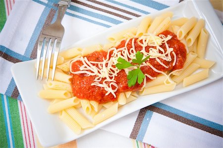 rigatoni parmesan - italian food pasta with tomato cheese and parsley Stock Photo - Budget Royalty-Free & Subscription, Code: 400-05353237