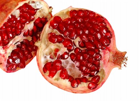 simsearch:400-03930798,k - red ripe juicy pomegranate fruit  isolated closeup Photographie de stock - Aubaine LD & Abonnement, Code: 400-05353315