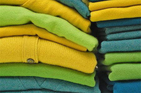 Stack of women's sweaters and cardigans in bright vivid colours Stock Photo - Budget Royalty-Free & Subscription, Code: 400-05353470