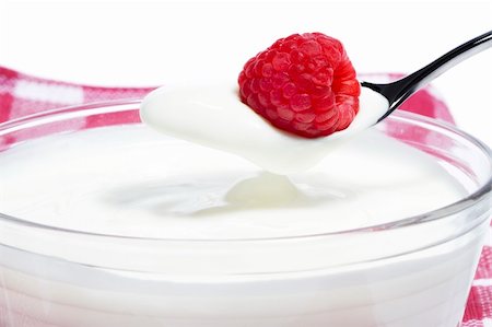 energy drink background - raspberry on a spoon with yogurt over a milk dessert with towel in background and white background Stock Photo - Budget Royalty-Free & Subscription, Code: 400-05353665