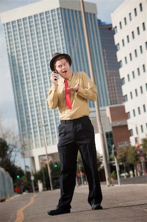 Surprised Caucasian business on phone call with open mouth Stock Photo - Budget Royalty-Free & Subscription, Code: 400-05353760