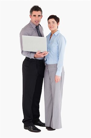 simsearch:400-04918393,k - Office workers holding a laptop against a white background Stock Photo - Budget Royalty-Free & Subscription, Code: 400-05353918