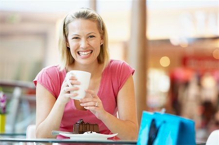 Woman Eating A Piece Of Cake At The Mall Photographie de stock - Aubaine LD & Abonnement, Code: 400-05364118