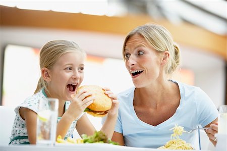 family eating burgers - Mother And Daughter Having Lunch Together At The Mall Stock Photo - Budget Royalty-Free & Subscription, Code: 400-05364142