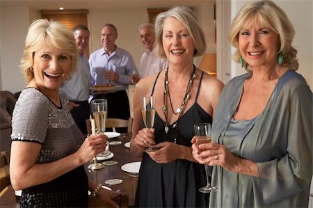 simsearch:400-05364195,k - Friends Enjoying A Glass Of Champagne At A Dinner Party Stock Photo - Budget Royalty-Free & Subscription, Code: 400-05364177