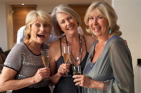 simsearch:400-05364195,k - Friends Enjoying A Glass Of Champagne At A Dinner Party Stock Photo - Budget Royalty-Free & Subscription, Code: 400-05364178