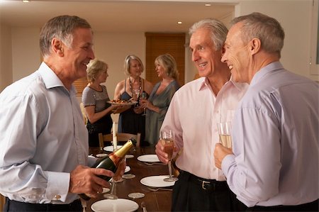 simsearch:400-05364195,k - Man Serving Champagne To His Guests At A Dinner Party Stock Photo - Budget Royalty-Free & Subscription, Code: 400-05364172