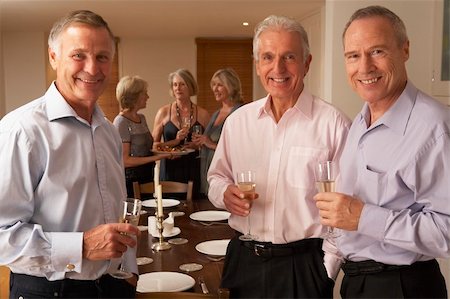 simsearch:400-05364195,k - Friends Enjoying A Glass Of Champagne At A Dinner Party Stock Photo - Budget Royalty-Free & Subscription, Code: 400-05364173