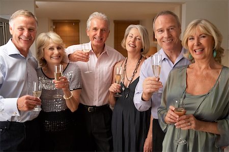 simsearch:400-05364195,k - Friends Enjoying A Glass Of Champagne At A Dinner Party Stock Photo - Budget Royalty-Free & Subscription, Code: 400-05364181