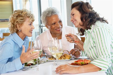 Friends Having Lunch Together At A Restaurant Stock Photo - Budget Royalty-Free & Subscription, Code: 400-05364284