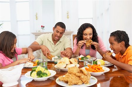 family eating chicken meat - Family Having A Meal Together At Home Stock Photo - Budget Royalty-Free & Subscription, Code: 400-05364295