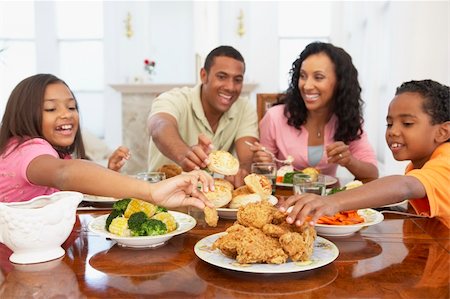 family eating chicken meat - Family Having A Meal Together At Home Stock Photo - Budget Royalty-Free & Subscription, Code: 400-05364293