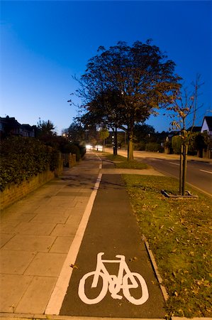 Bicycle lane with white mark of bicycle sign, London. Stockbilder - Microstock & Abonnement, Bildnummer: 400-05365424