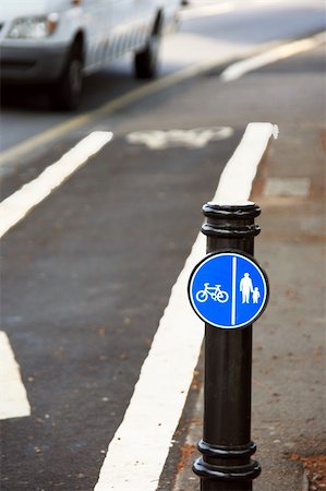 Bicycle lane with white mark of bicycle sign, London. Stockbilder - Microstock & Abonnement, Bildnummer: 400-05365427