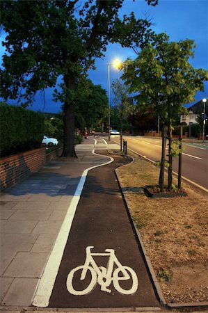 Bicycle lane with white mark of bicycle sign, London. Stockbilder - Microstock & Abonnement, Bildnummer: 400-05365422