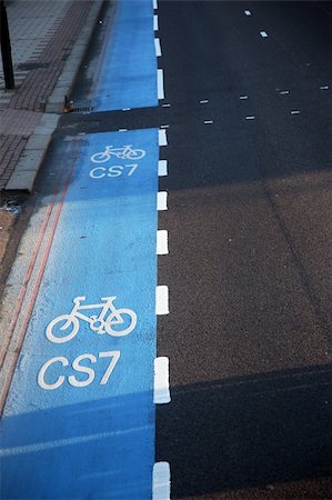 Bicycle lane with white mark of bicycle sign, London. Stockbilder - Microstock & Abonnement, Bildnummer: 400-05365434