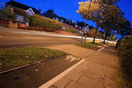 Bicycle lane with white mark of bicycle sign, London. Stockbilder - Microstock & Abonnement, Bildnummer: 400-05365436