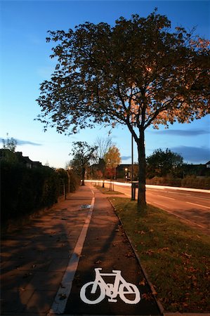 Bicycle lane with white mark of bicycle sign, London. Stockbilder - Microstock & Abonnement, Bildnummer: 400-05365438