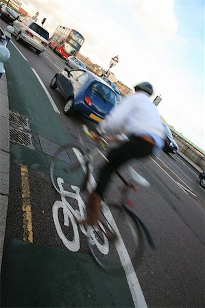 Bicycle lane with white mark of bicycle sign, London. Stockbilder - Microstock & Abonnement, Bildnummer: 400-05365441