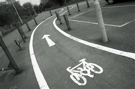 Bicycle lane with white mark of bicycle sign, London. Stockbilder - Microstock & Abonnement, Bildnummer: 400-05365454