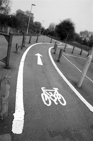 Bicycle lane with white mark of bicycle sign, London. Stockbilder - Microstock & Abonnement, Bildnummer: 400-05365452