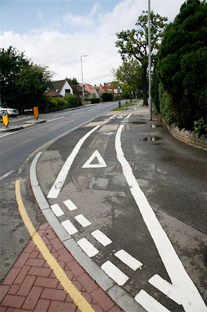 Bicycle lane with white mark of bicycle sign, London. Stockbilder - Microstock & Abonnement, Bildnummer: 400-05365462