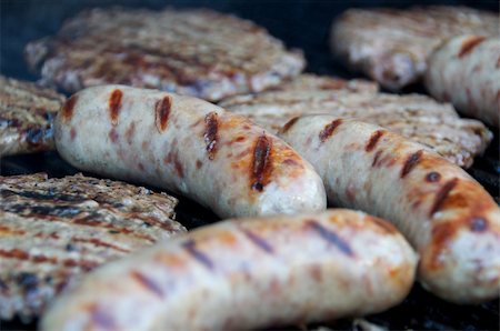 processed meat - Bratwursts and hamburgers cooking on the grill. Stock Photo - Budget Royalty-Free & Subscription, Code: 400-05365635