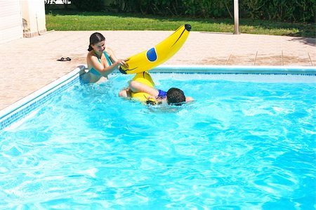 Couple having fun in swimming pool. Stock Photo - Budget Royalty-Free & Subscription, Code: 400-05366777