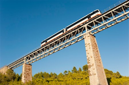 Narrow gauge train crossing a scenic bridge Stock Photo - Budget Royalty-Free & Subscription, Code: 400-05366790