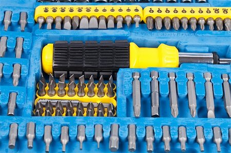 deymos (artist) - A set of screw tips and extensions with the screwdriver in the blue toolbox isolated on white background Photographie de stock - Aubaine LD & Abonnement, Code: 400-05366978