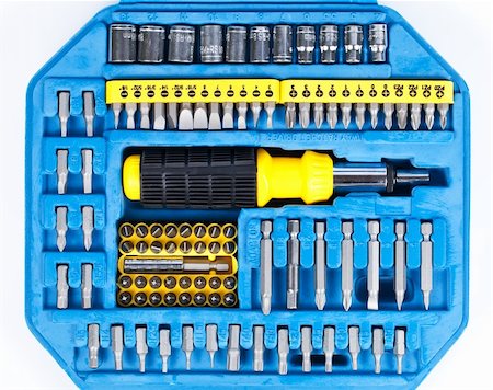 deymos (artist) - A set of screw tips and extensions with the screwdriver in the blue toolbox isolated on white background Photographie de stock - Aubaine LD & Abonnement, Code: 400-05366979