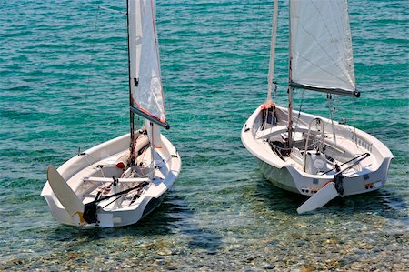 pedal boat - Two white small sailboats Stock Photo - Budget Royalty-Free & Subscription, Code: 400-05367808