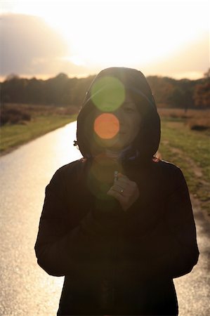 Asian woman stands in morning sunshine Stockbilder - Microstock & Abonnement, Bildnummer: 400-05367919
