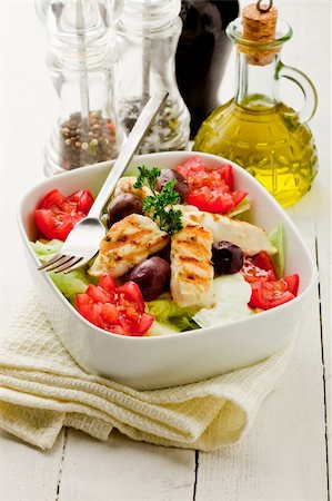 photo of delicious chicken salad on white woden table Stockbilder - Microstock & Abonnement, Bildnummer: 400-05368352