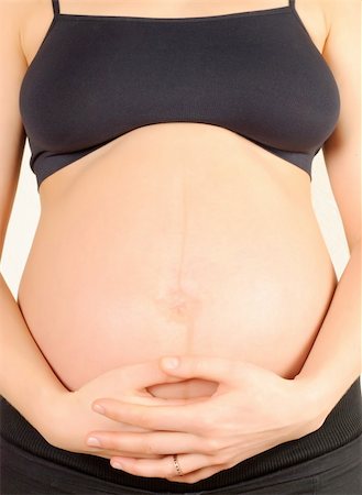 simsearch:400-04859723,k - pregnant woman, embracing the belly on a white background Fotografie stock - Microstock e Abbonamento, Codice: 400-05360054