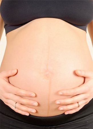 simsearch:400-04859723,k - pregnant woman, embracing the belly on a white background Fotografie stock - Microstock e Abbonamento, Codice: 400-05360053