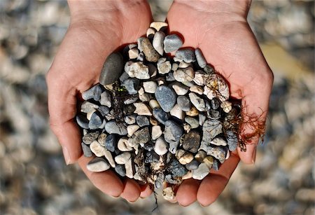 simsearch:400-04640528,k - Abstract and Objects. Many small stones in hands Stock Photo - Budget Royalty-Free & Subscription, Code: 400-05360065