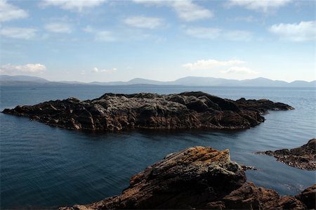 simsearch:400-04967957,k - scenic view in kerry ireland of rocks and sea with mountains against a beautiful blue cloudy sky Stock Photo - Budget Royalty-Free & Subscription, Code: 400-05360163