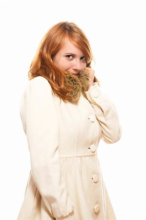 young redhead woman covering her face in fawn winter coat on white background Stock Photo - Budget Royalty-Free & Subscription, Code: 400-05360198