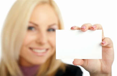 simsearch:400-04648812,k - positive blond female out of focus presenting blank businesscard Stock Photo - Budget Royalty-Free & Subscription, Code: 400-05360300