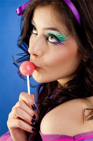 simsearch:400-05197146,k - beautiful girl colourfull make-up licking lollipop looking up Stock Photo - Budget Royalty-Free & Subscription, Code: 400-05360399