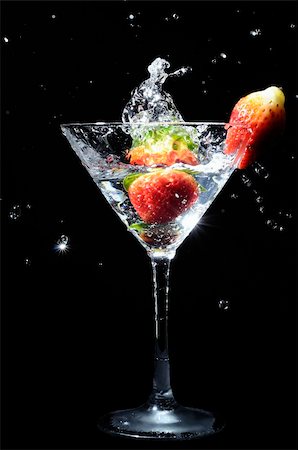 spilled alcoholic drink on bar - strawberry splashing into martini cocktail drink Stock Photo - Budget Royalty-Free & Subscription, Code: 400-05360793
