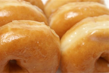 donut hole - A macro shot of a box of sugar glazed donuts ready for consumption. Stock Photo - Budget Royalty-Free & Subscription, Code: 400-05361547