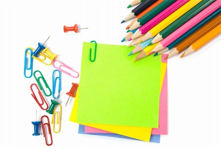 Colored pencils, clips and note paper on white Foto de stock - Royalty-Free Super Valor e Assinatura, Número: 400-05362213