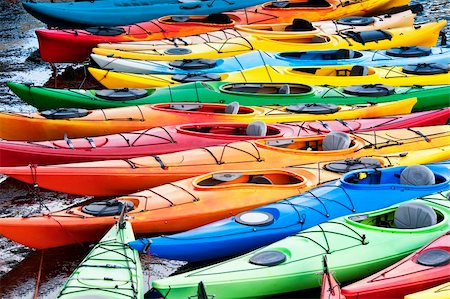 photo of empty canoe on water - Colorful fiberglass kayaks tethered to a dock as seen from above Stock Photo - Budget Royalty-Free & Subscription, Code: 400-05362223