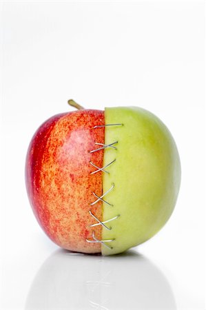 scars - red and green apple putted togetherr with a sulture Stock Photo - Budget Royalty-Free & Subscription, Code: 400-05362236