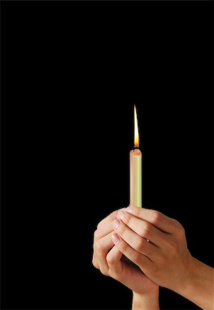 easter blessings - Burning candle in woman hands on the black background Stock Photo - Budget Royalty-Free & Subscription, Code: 400-05363072