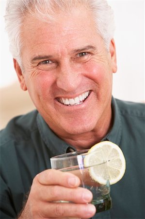 Man Having A Drink At Home Stockbilder - Microstock & Abonnement, Bildnummer: 400-05374204