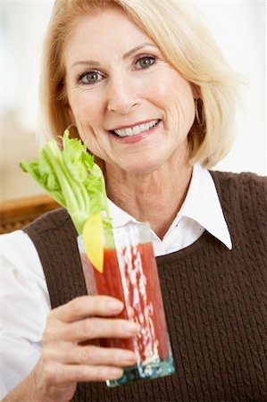 simsearch:400-05364217,k - Woman Drinking A Bloody Mary Stockbilder - Microstock & Abonnement, Bildnummer: 400-05374201